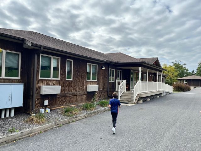 Walking toward the lodge entrance.